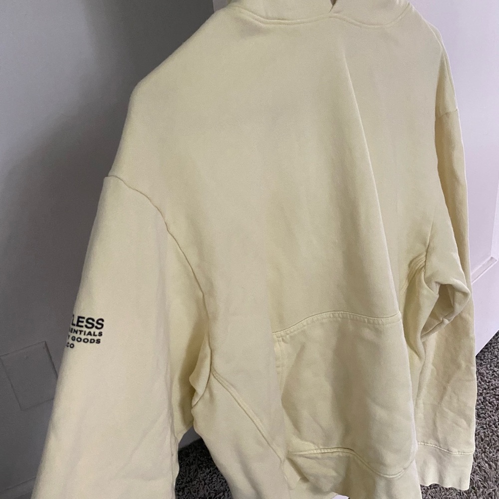 Pale yellow TALENTLESS hoodie